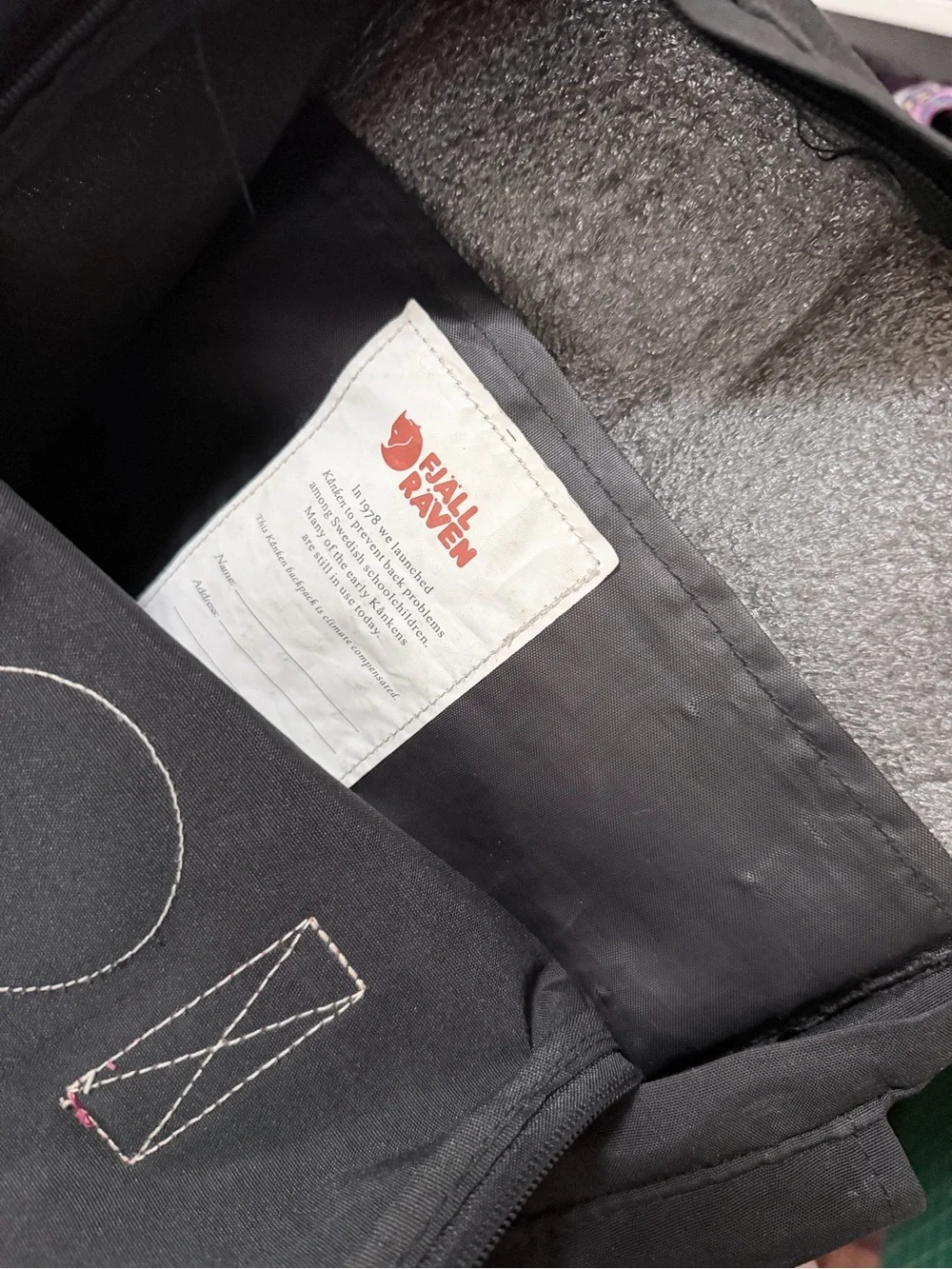Fjallraven Kanken Black Backpack with Red Accents